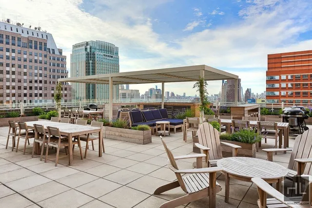a view of a patio with a table and chairs