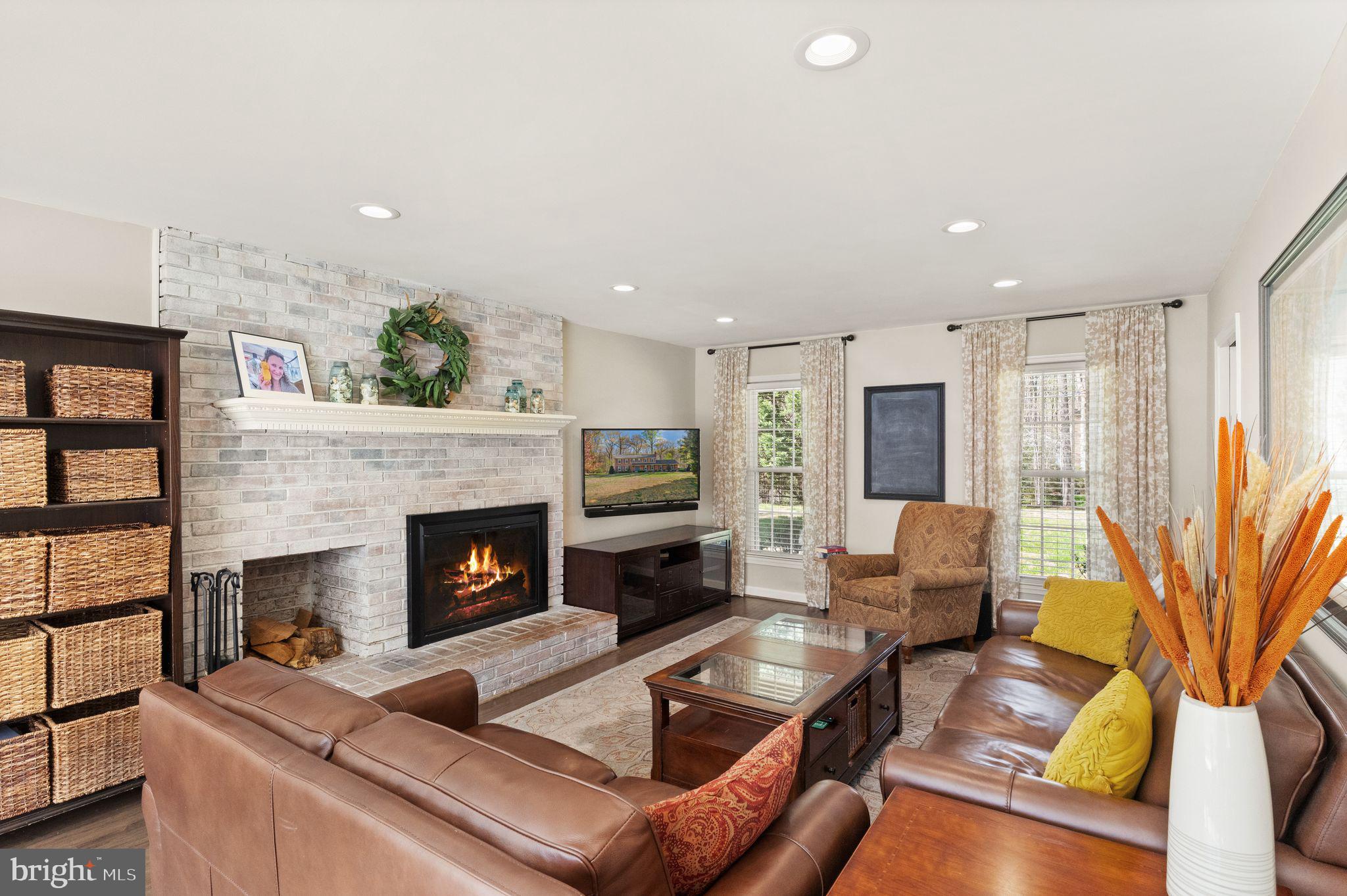 8019 Stillbrooke Road Manassas, VA 20112 - Photo 15 of 80 Gorgeous fireplace frames the family room.