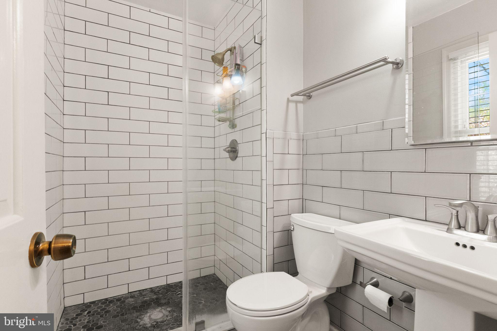 8019 Stillbrooke Road Manassas, VA 20112 - Photo 32 of 80 Classic tile work and frameless glass.