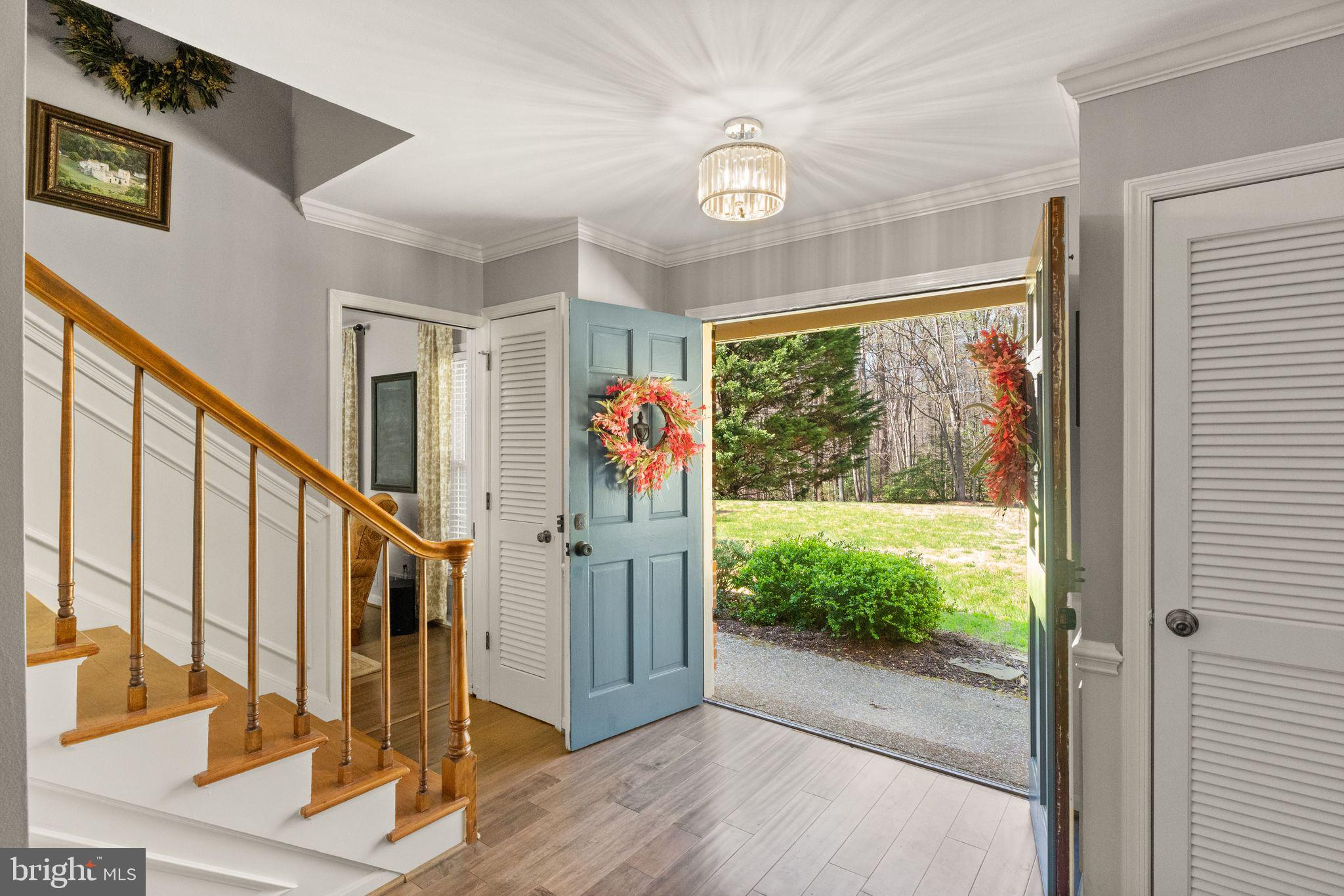 8019 Stillbrooke Road Manassas, VA 20112 - Photo 8 of 80 Two, large coat closets frame the door.
