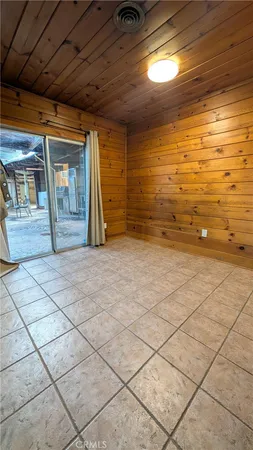 a large kitchen with a stove a sink and a refrigerator