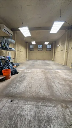 a view of a hallway with a ceiling fan
