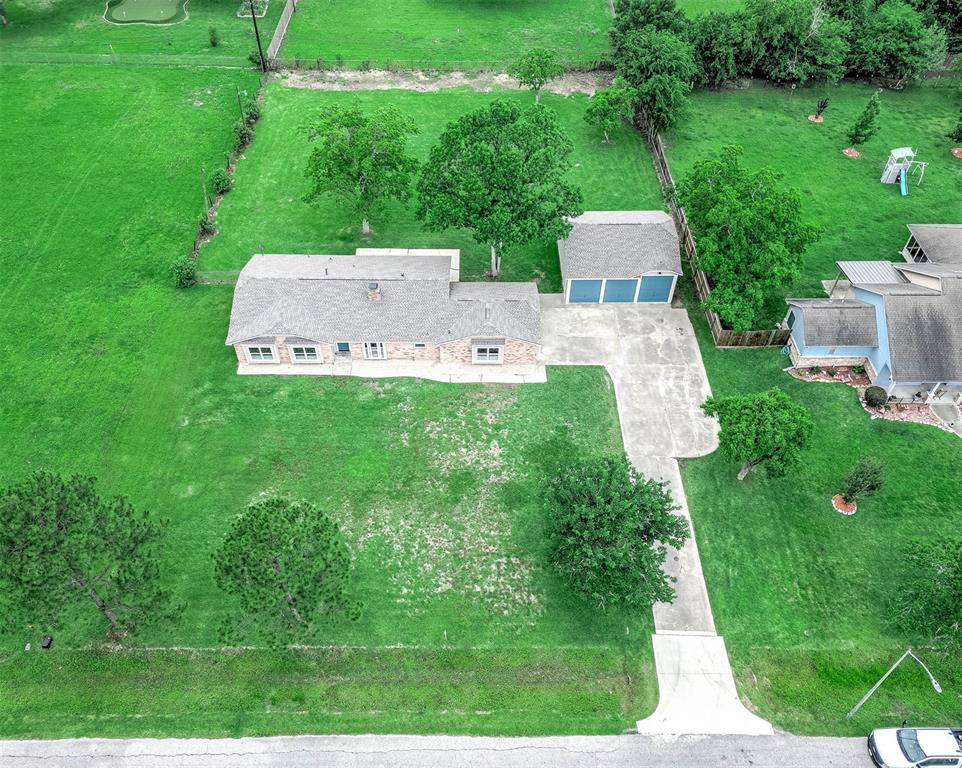 a aerial view of a house with pool