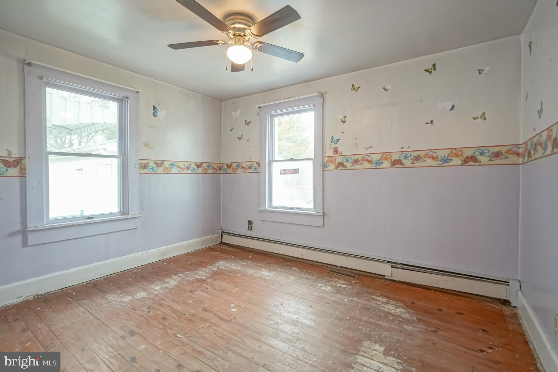 32 Tilbury Road Salem, NJ 08079 - Photo 13 of 30 a view of empty room with wooden floor and fan