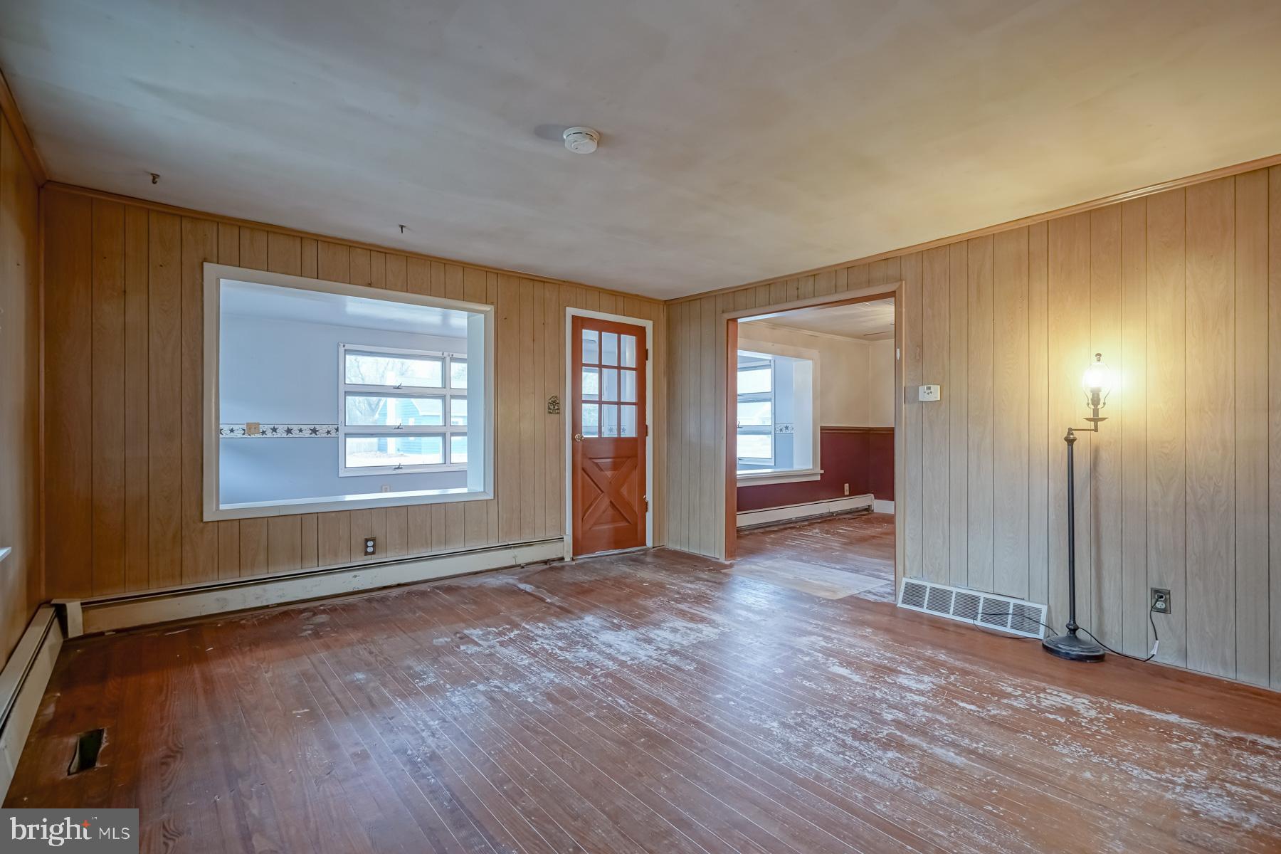 32 Tilbury Road Salem, NJ 08079 - Photo 5 of 30 an empty room with window and wooden floor