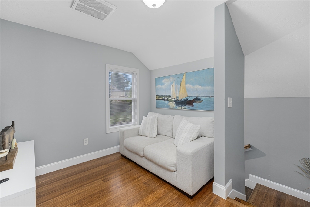 69 Denver Street Fall River, MA 02721 - Photo 27 of 35 a living room with furniture and a wooden floor