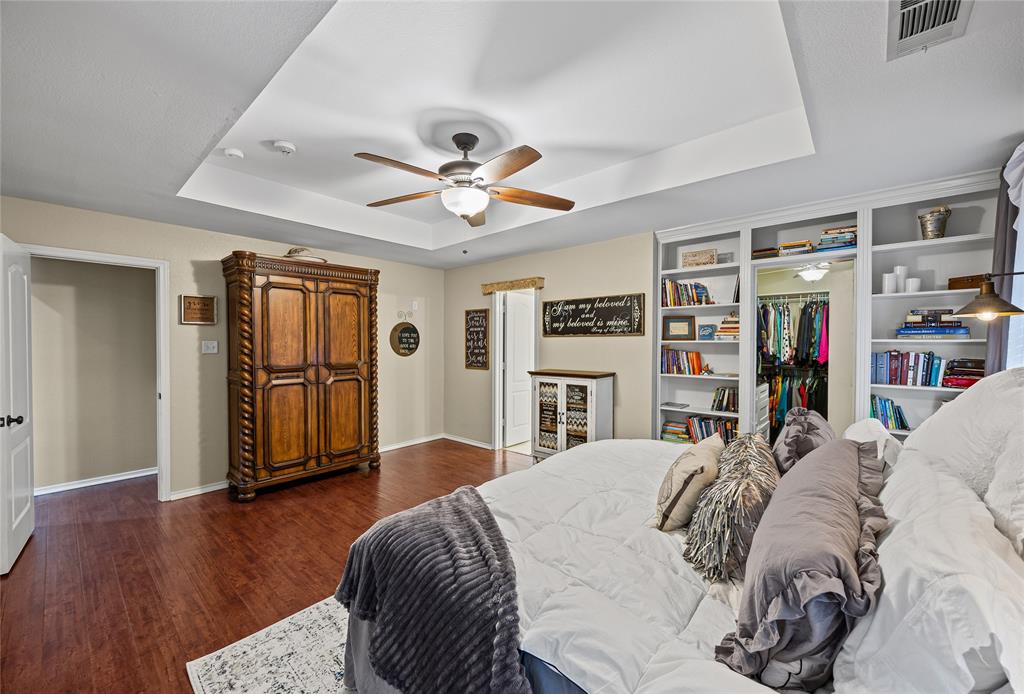112 Springfield Lane Red Oak, TX 75165 - Photo 18 of 40 a bedroom with a large bed and a window