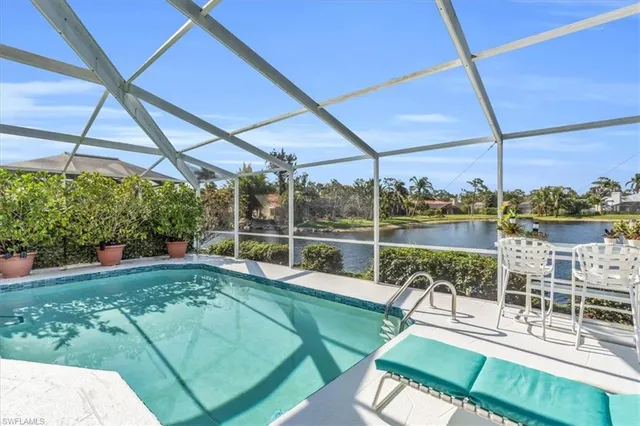 a view of a swimming pool with a patio