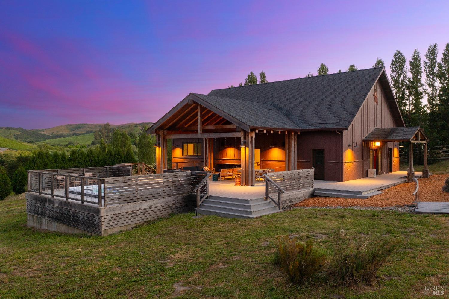 a view of a house with swimming pool and sitting area
