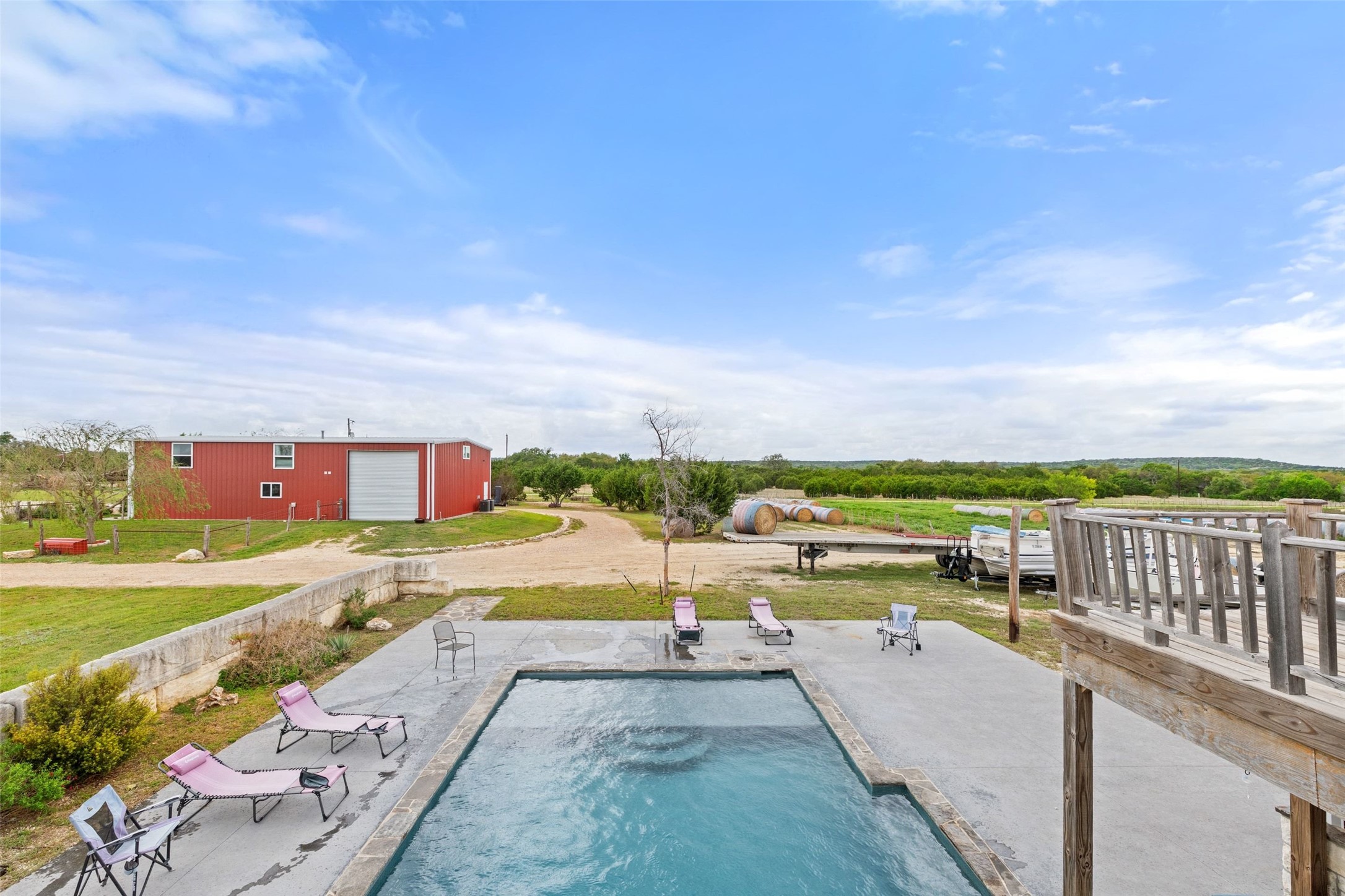 1301 County Road 228 Florence, TX 76527 - Photo 8 of 40 a view of swimming pool with outdoor seating and yard