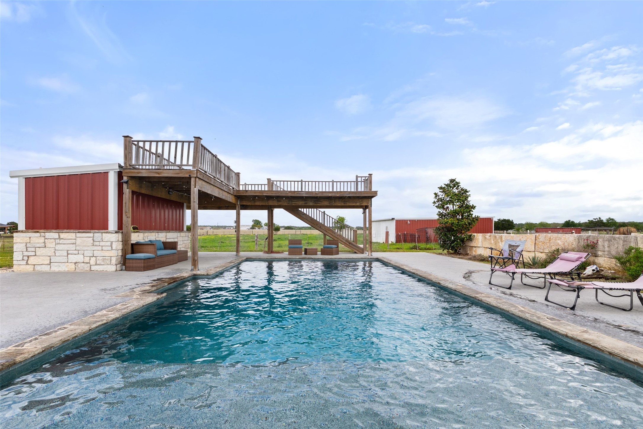 1301 County Road 228 Florence, TX 76527 - Photo 9 of 40 a view of a swimming pool with a lounge chair