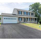 a view of an house with swimming pool and a yard