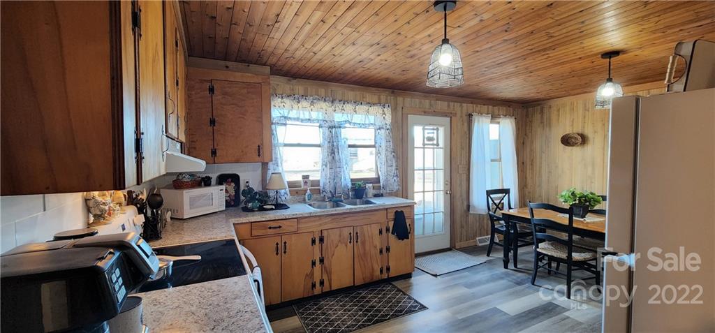 157 Moss Road Rutherfordton, NC 28139 - Photo 11 of 36 a room with furniture a large window and wooden floor