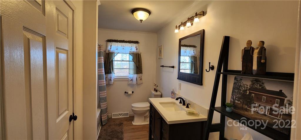 157 Moss Road Rutherfordton, NC 28139 - Photo 13 of 36 a bathroom with a sink and a mirror