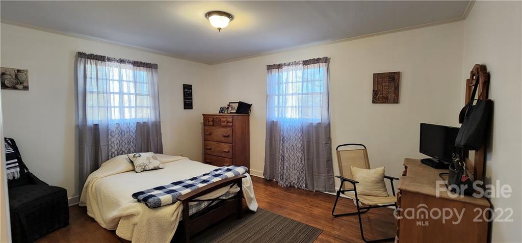 157 Moss Road Rutherfordton, NC 28139 - Photo 18 of 36 a bed sitting in a bedroom next to a window