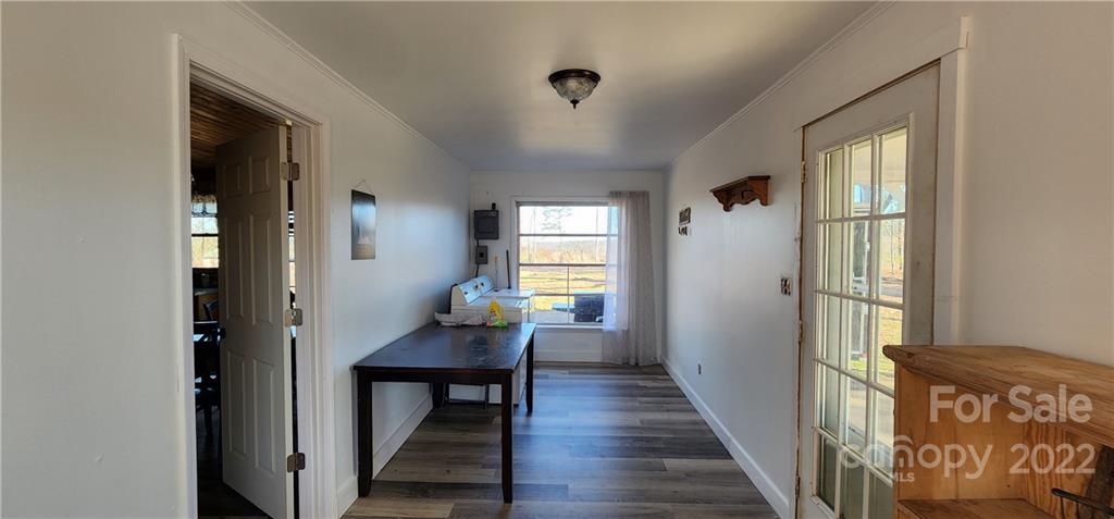 157 Moss Road Rutherfordton, NC 28139 - Photo 24 of 36 a view of a hallway with wooden floor and furniture