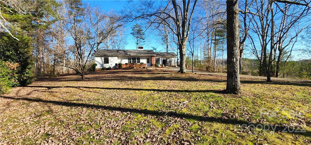 157 Moss Road Rutherfordton, NC 28139 - Photo 35 of 36 a view of a house with a yard covered with snow
