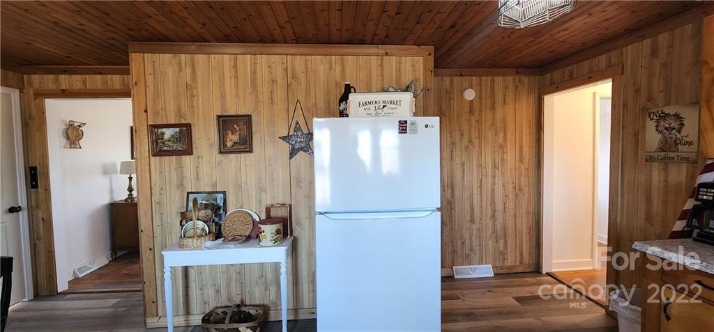 157 Moss Road Rutherfordton, NC 28139 - Photo 10 of 36 a white refrigerator freezer and a wooden floor