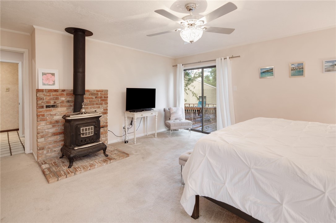 2902 Chaparral Circle Bryan, TX 77802 - Photo 11 of 26 a bedroom with a bed and a flat screen tv