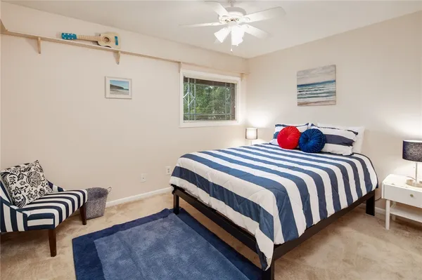 a bedroom with a bed and a couch