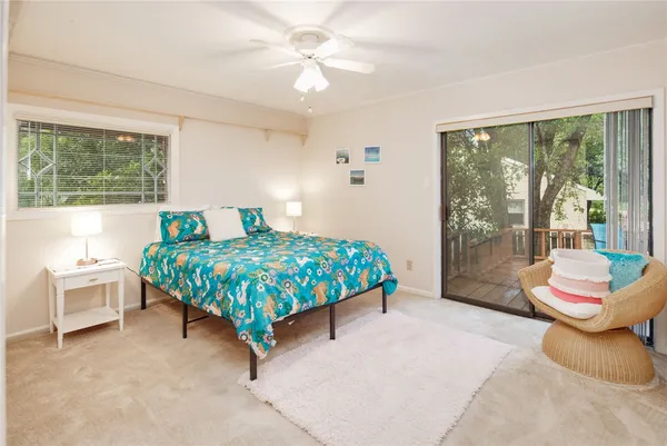 a bedroom with a bed and a couch
