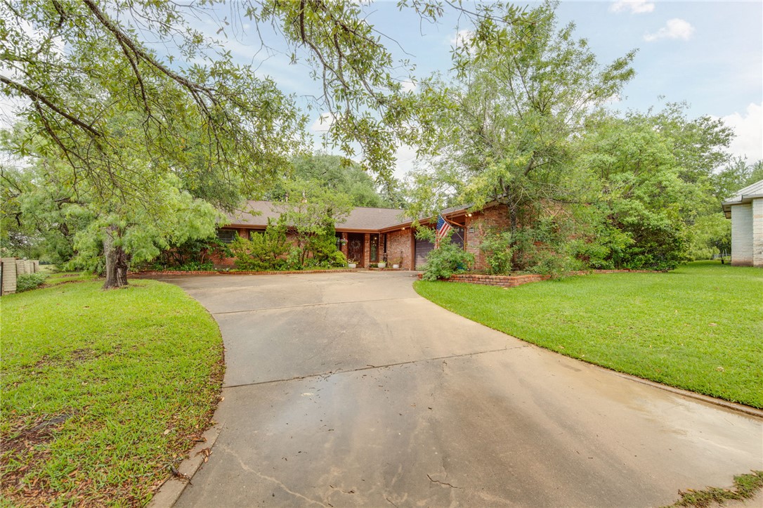 2902 Chaparral Circle Bryan, TX 77802 - Photo 2 of 26 a view of a park with large trees