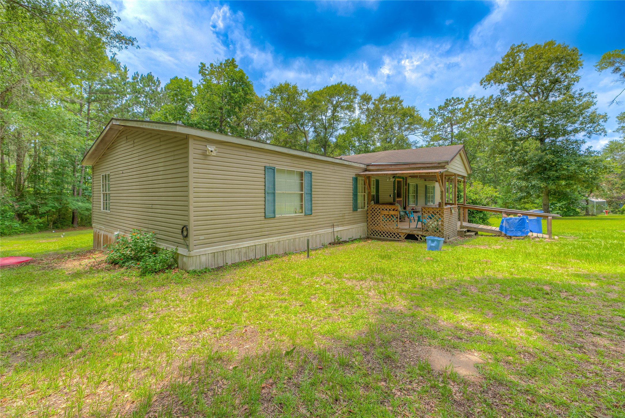 657 Parrish Road Livingston, TX 77351 - Photo 22 of 47 a view of a house with a backyard