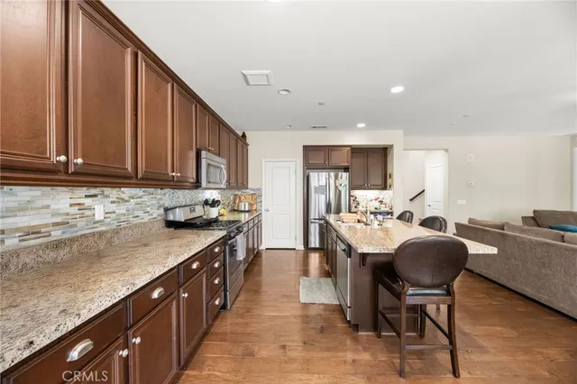 a bathroom with a sink vanity mirror and toilet