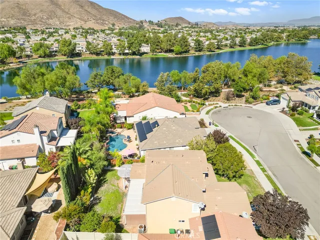 an aerial view of a houses with a lake view