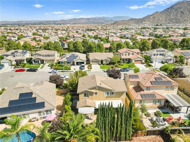 a view of a lush green hillside and a houses