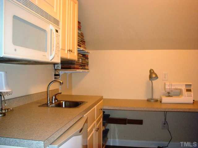 2845 Anfield Road Raleigh, NC 27606 - Photo 15 of 25 Upstairs features Handy Kitchen/Craft Area with Cupboards, Counter Space, Sink and Built-in Microwave Other