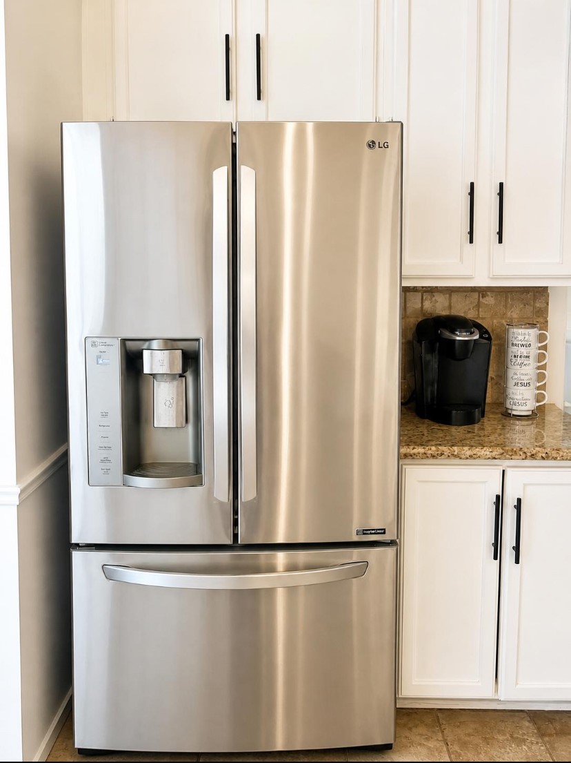 15922 Cutten Road Houston, TX 77070 - Photo 20 of 22 a white refrigerator freezer and a stove sitting inside of a kitchen