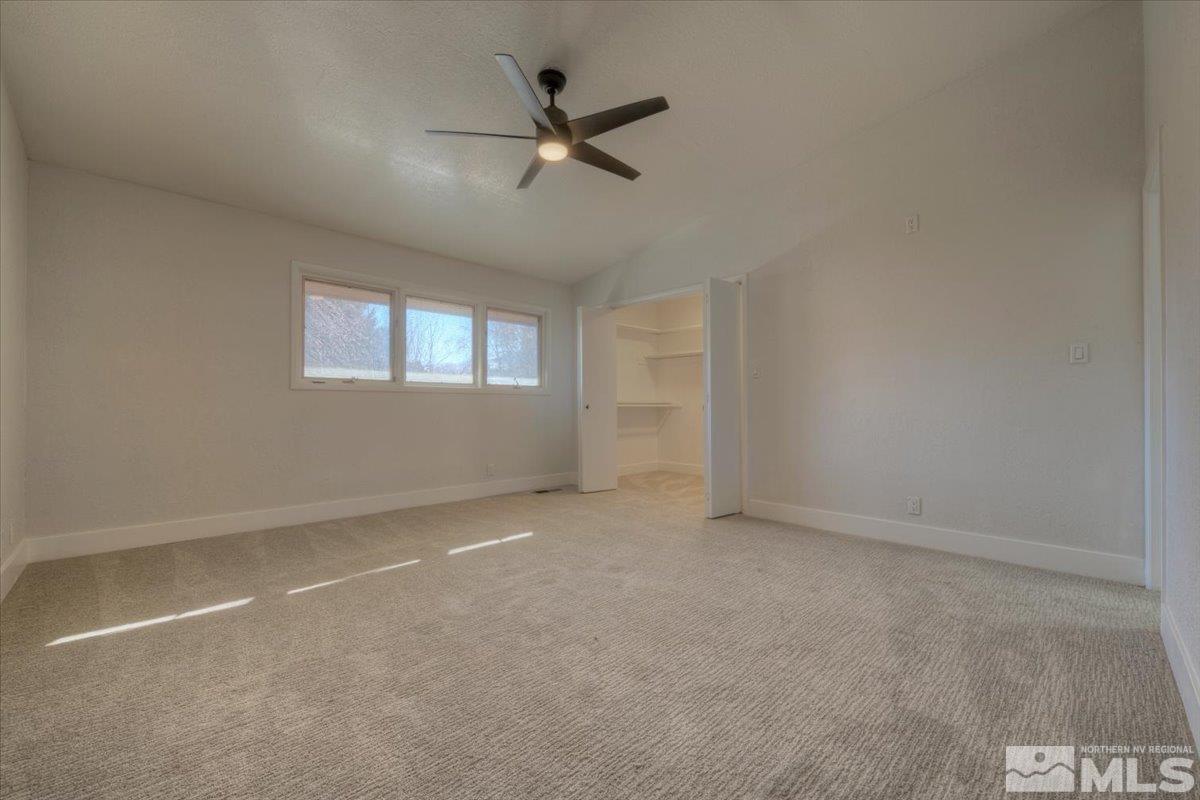 2014 Branch Reno, NV 89509 - Photo 19 of 40 en empty room with windows and ceiling fan view