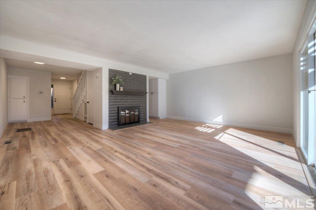 2014 Branch Reno, NV 89509 - Photo 8 of 40 a view of empty room with wooden floor and fireplace