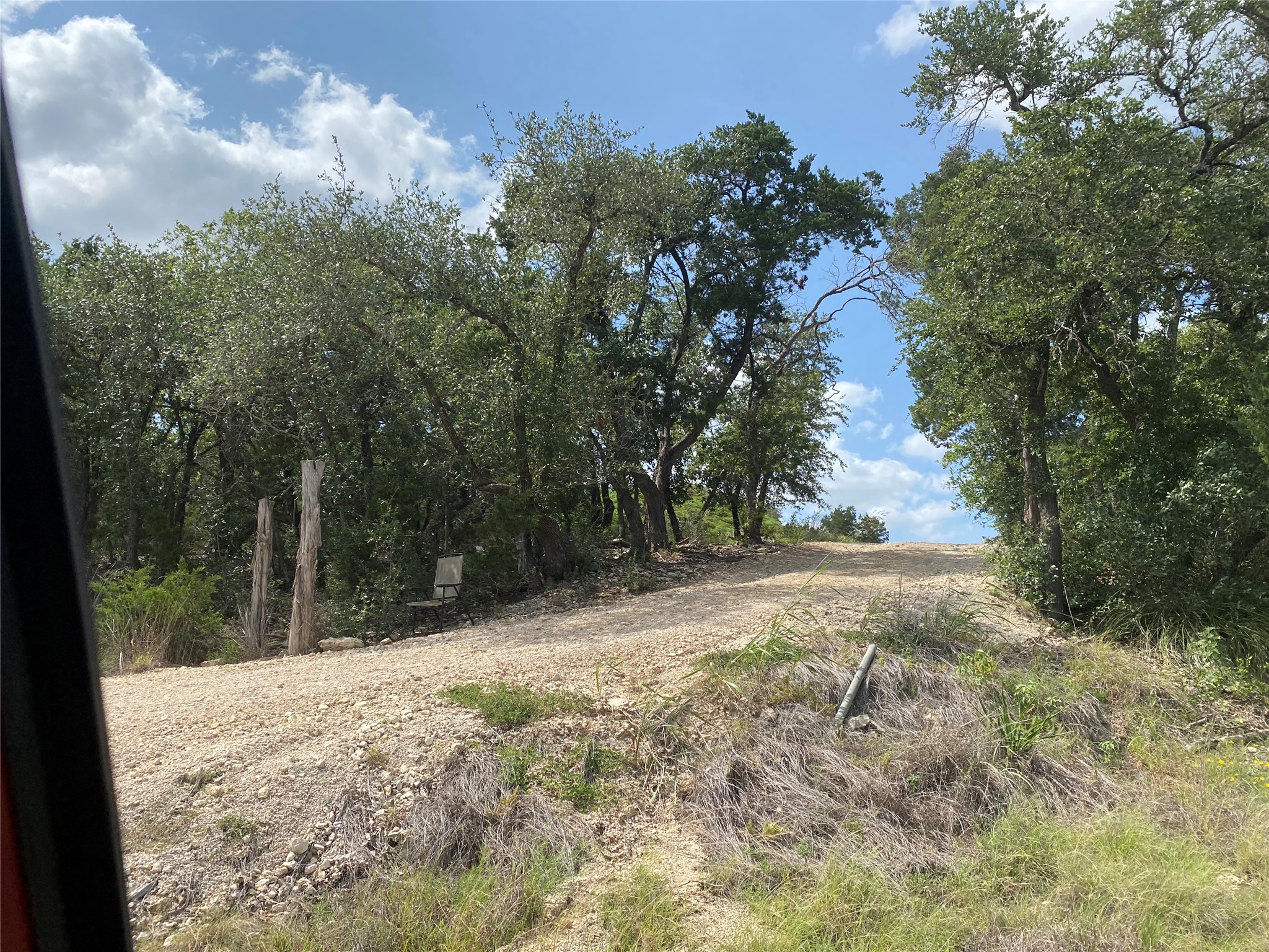 Tbd Whisper Ridge Wimberley, TX 78676 - Photo 3 of 7 A secluded, treed lot awaits, offering a private escape with natural landscaping and abundant foliage.