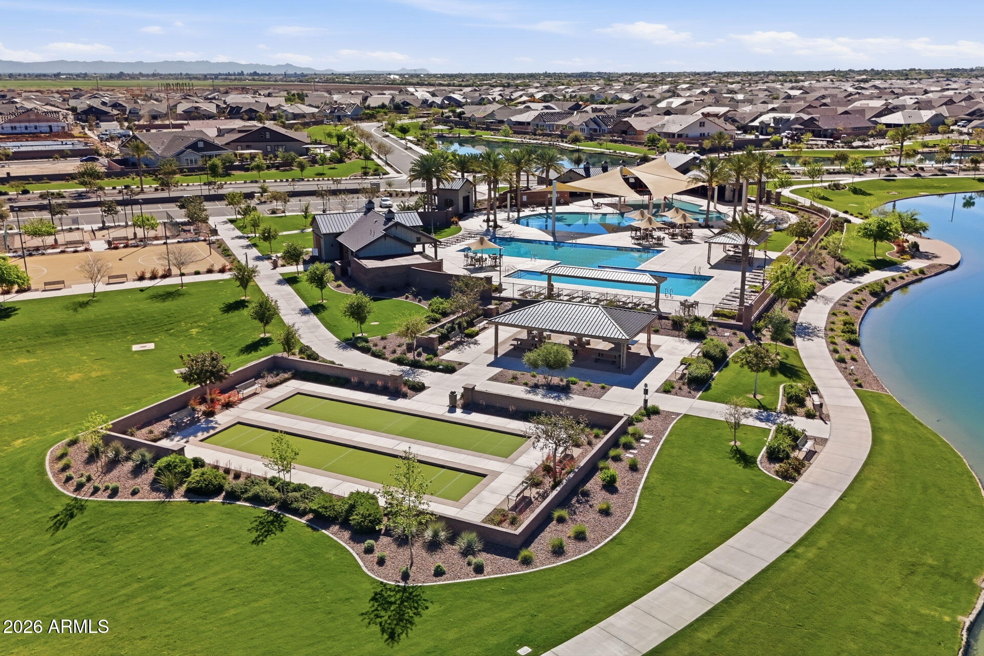 23069 East Mayberry Road Queen Creek, AZ 85142 - Photo 38 of 48 a view of a swimming pool with a garden