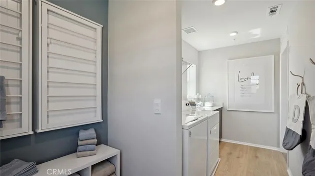 a room with a wooden floor and entryway