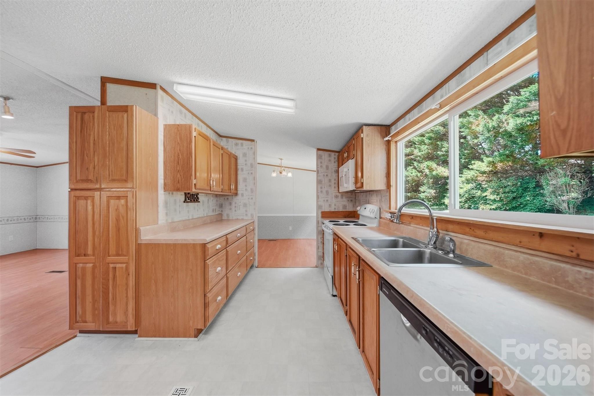 1488 Watermill Road Morganton, NC 28655 - Photo 11 of 38 a kitchen with stainless steel appliances granite countertop a sink and a stove