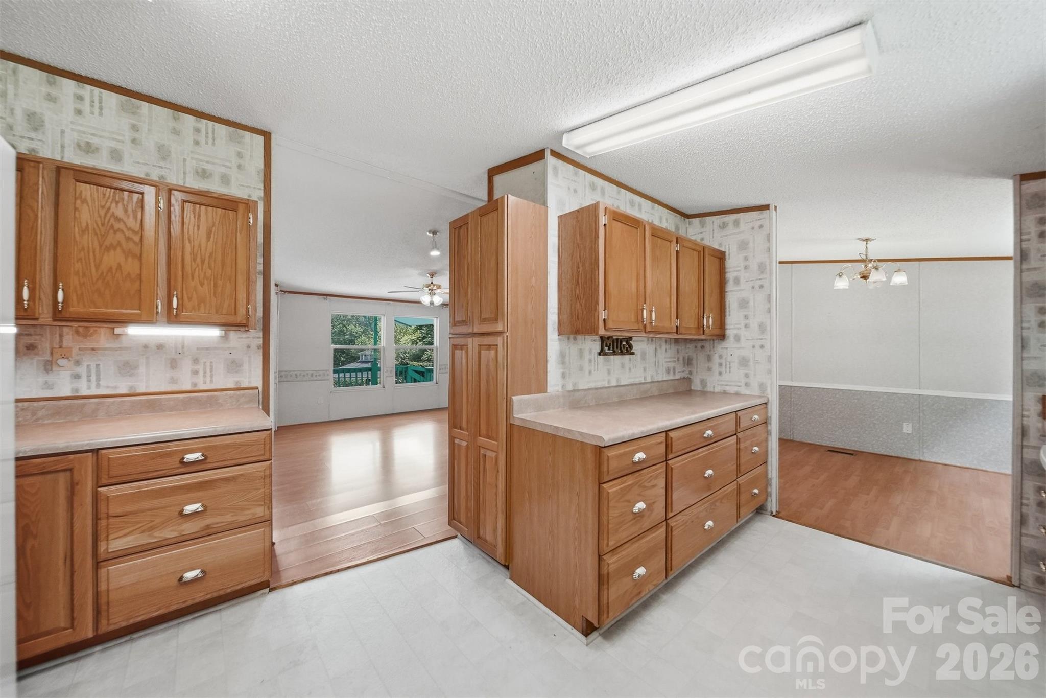 1488 Watermill Road Morganton, NC 28655 - Photo 13 of 38 a kitchen with stainless steel appliances granite countertop a stove and a refrigerator