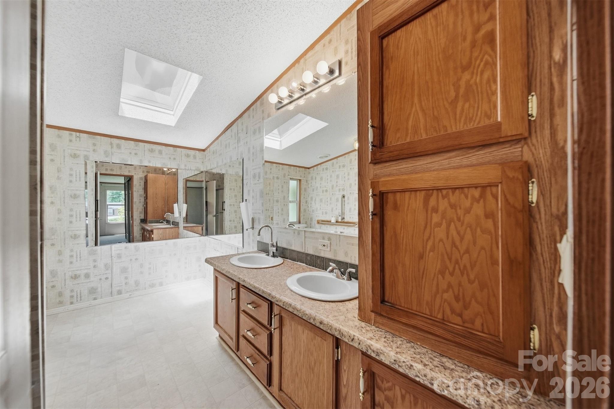 1488 Watermill Road Morganton, NC 28655 - Photo 17 of 38 a bathroom with a sink a mirror and a shower