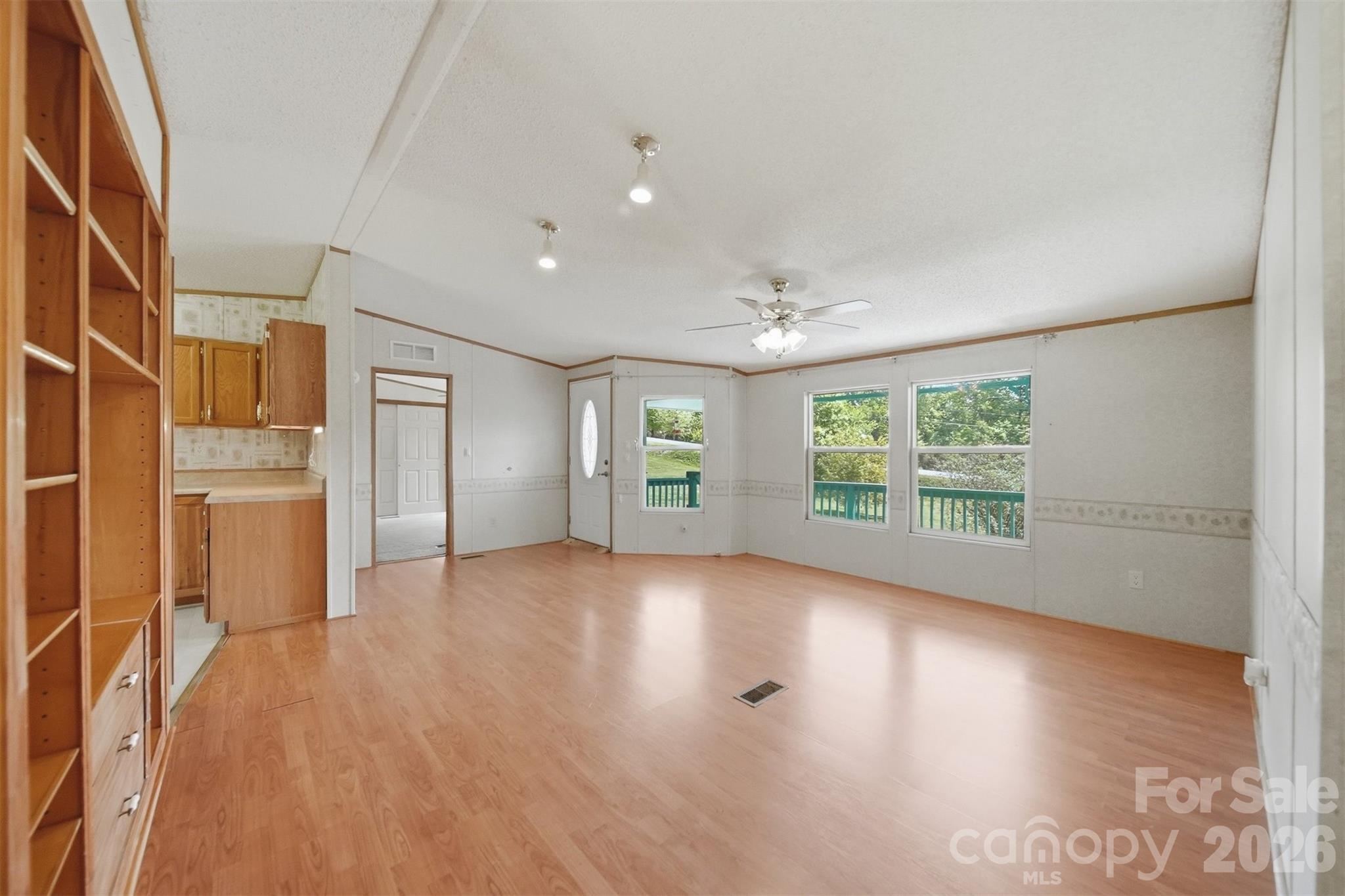 1488 Watermill Road Morganton, NC 28655 - Photo 2 of 38 a view of a livingroom with wooden floor and windows