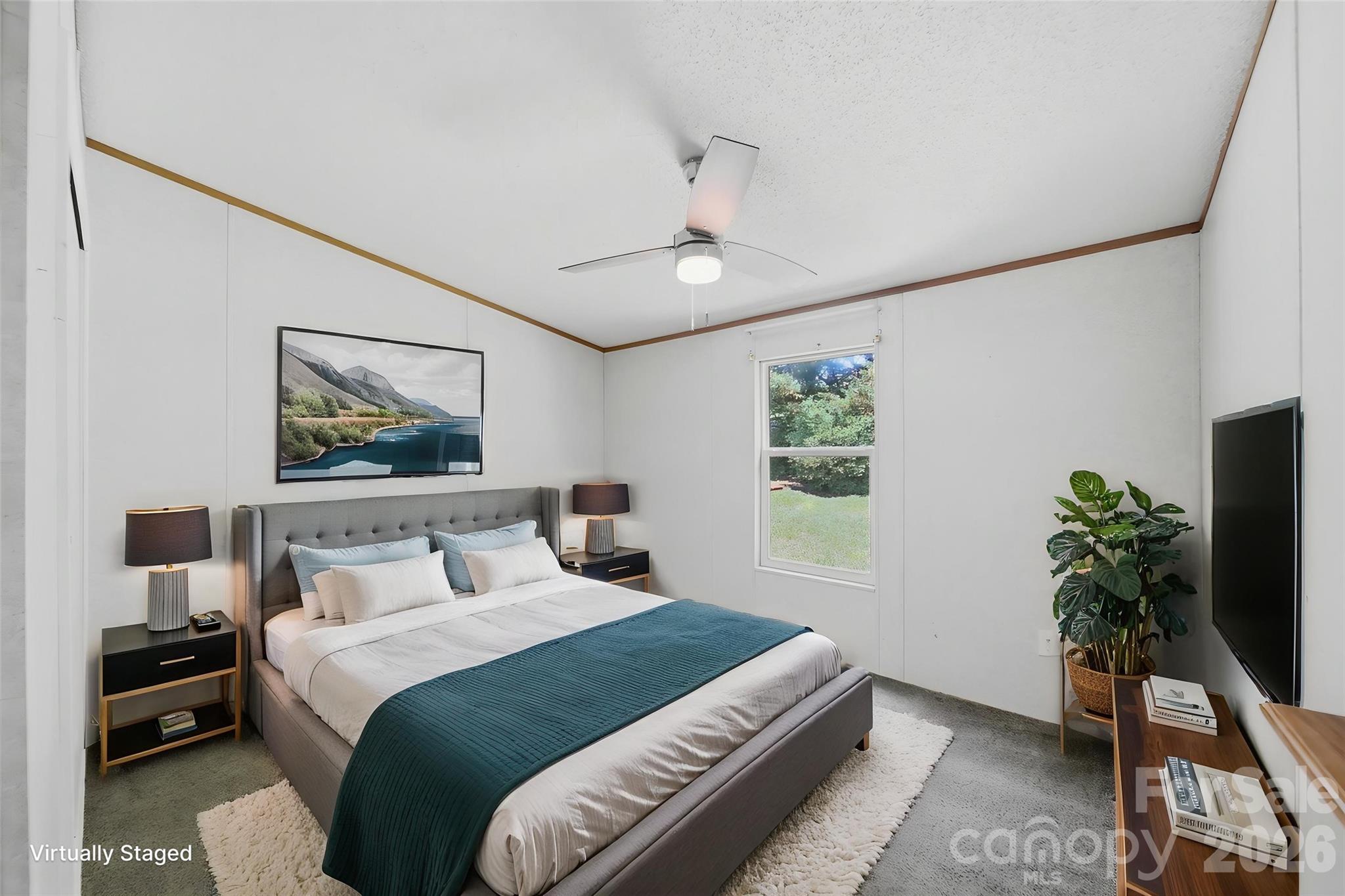 1488 Watermill Road Morganton, NC 28655 - Photo 23 of 38 a bedroom with a bed and a potted plant
