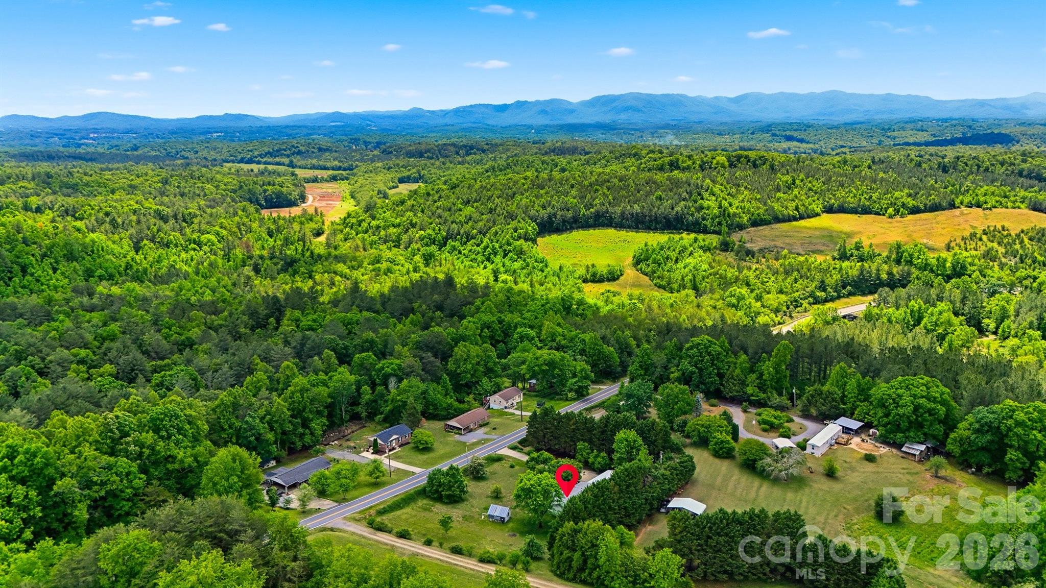 1488 Watermill Road Morganton, NC 28655 - Photo 37 of 38 a view of a lush green field with lots of bushes