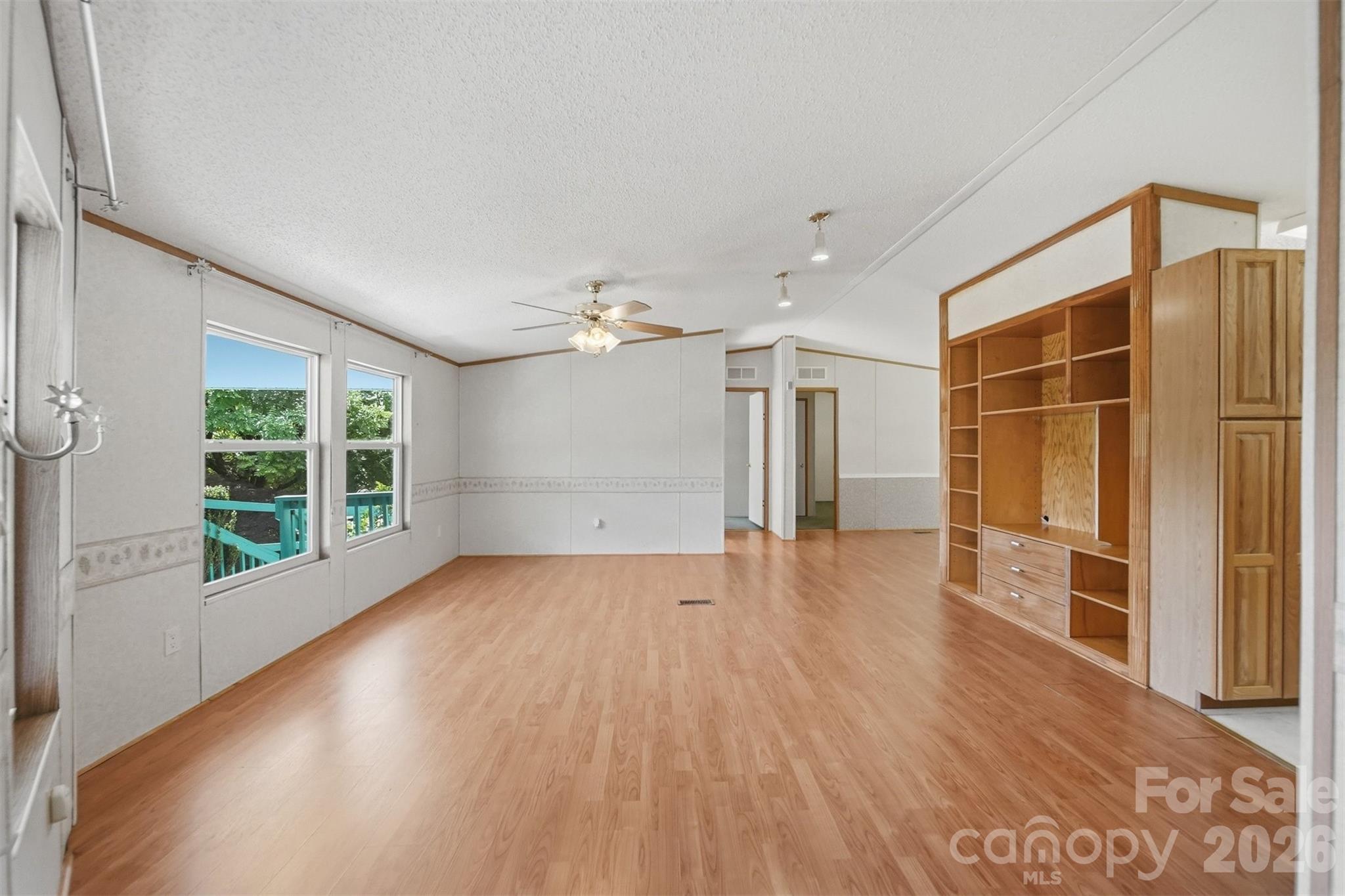 1488 Watermill Road Morganton, NC 28655 - Photo 5 of 38 a view of empty room with wooden floor and fan