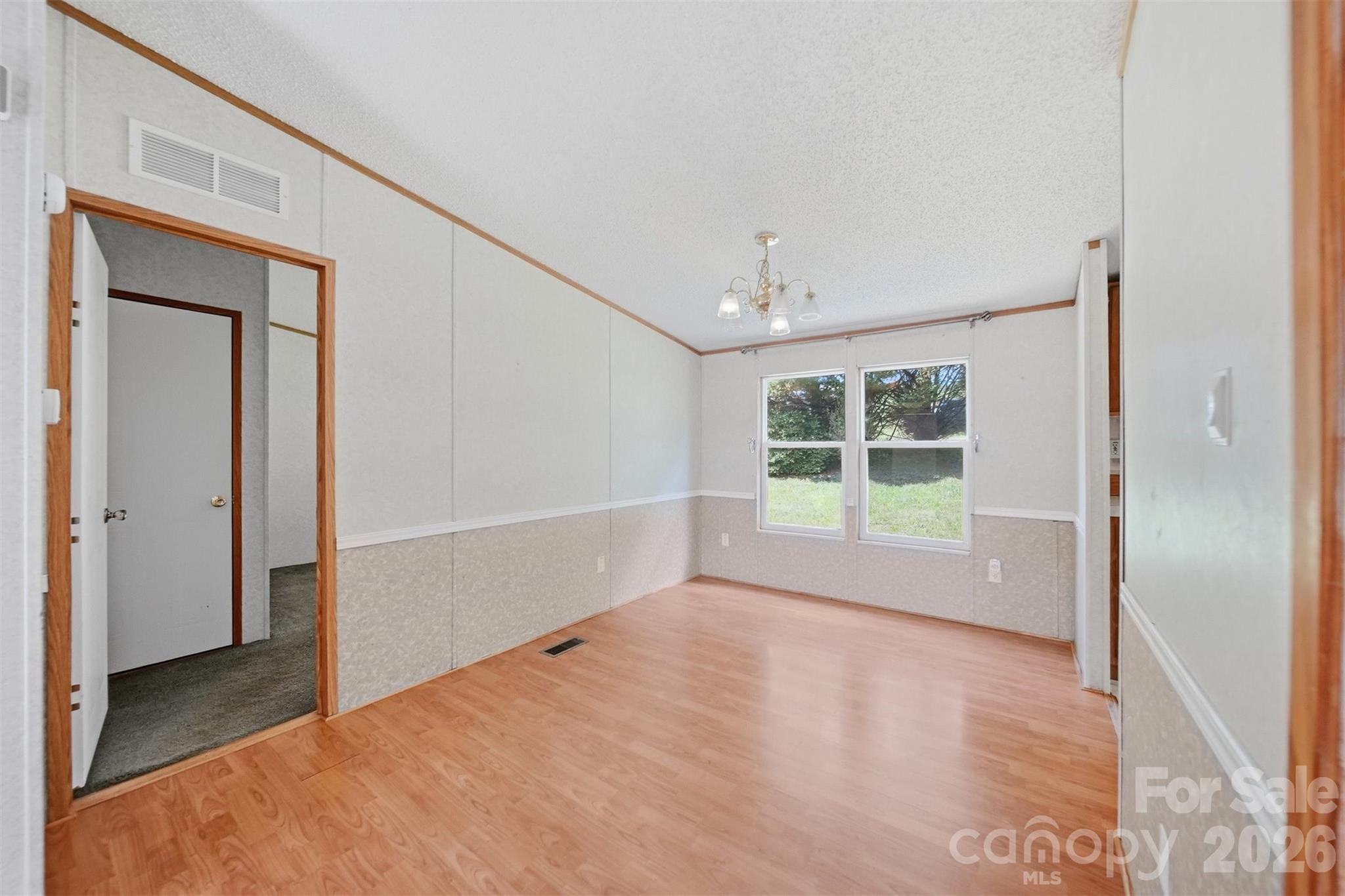1488 Watermill Road Morganton, NC 28655 - Photo 6 of 38 a view of empty room with wooden floor and fan