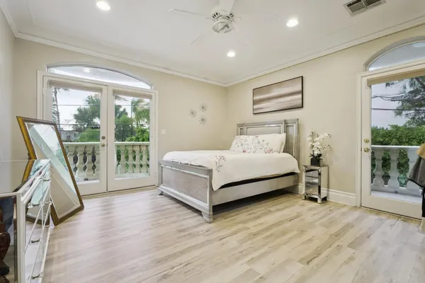 a bedroom with a bed and a view of bedroom