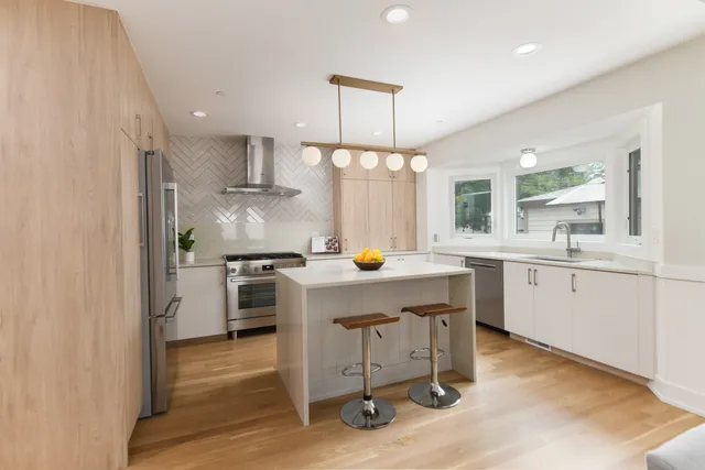 a kitchen with a sink cabinets and window