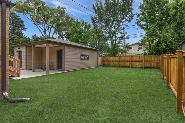 a backyard of a house with lots of green space
