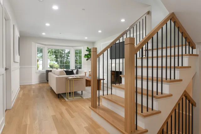 a view of entryway with wooden floor and furniture