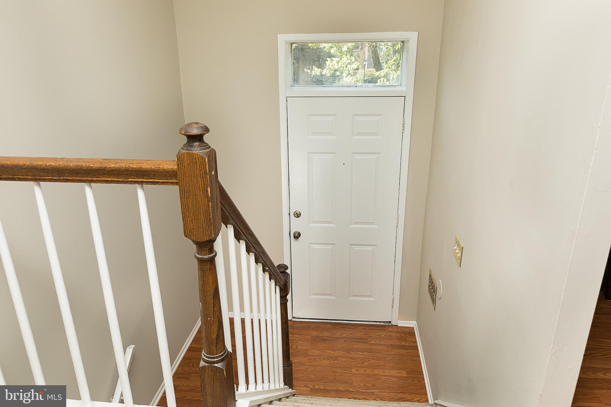 9791 Early Spring Way Columbia, MD 21046 - Photo 4 of 31 Foyer from Upper Landing